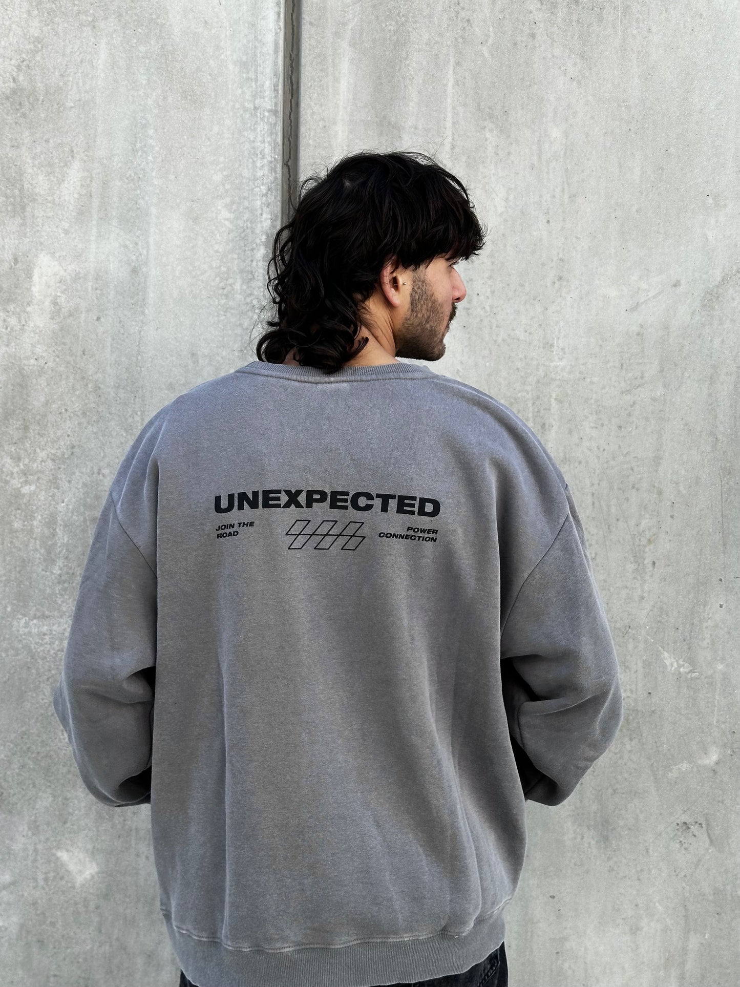 Buzo UNEXPECTED gris