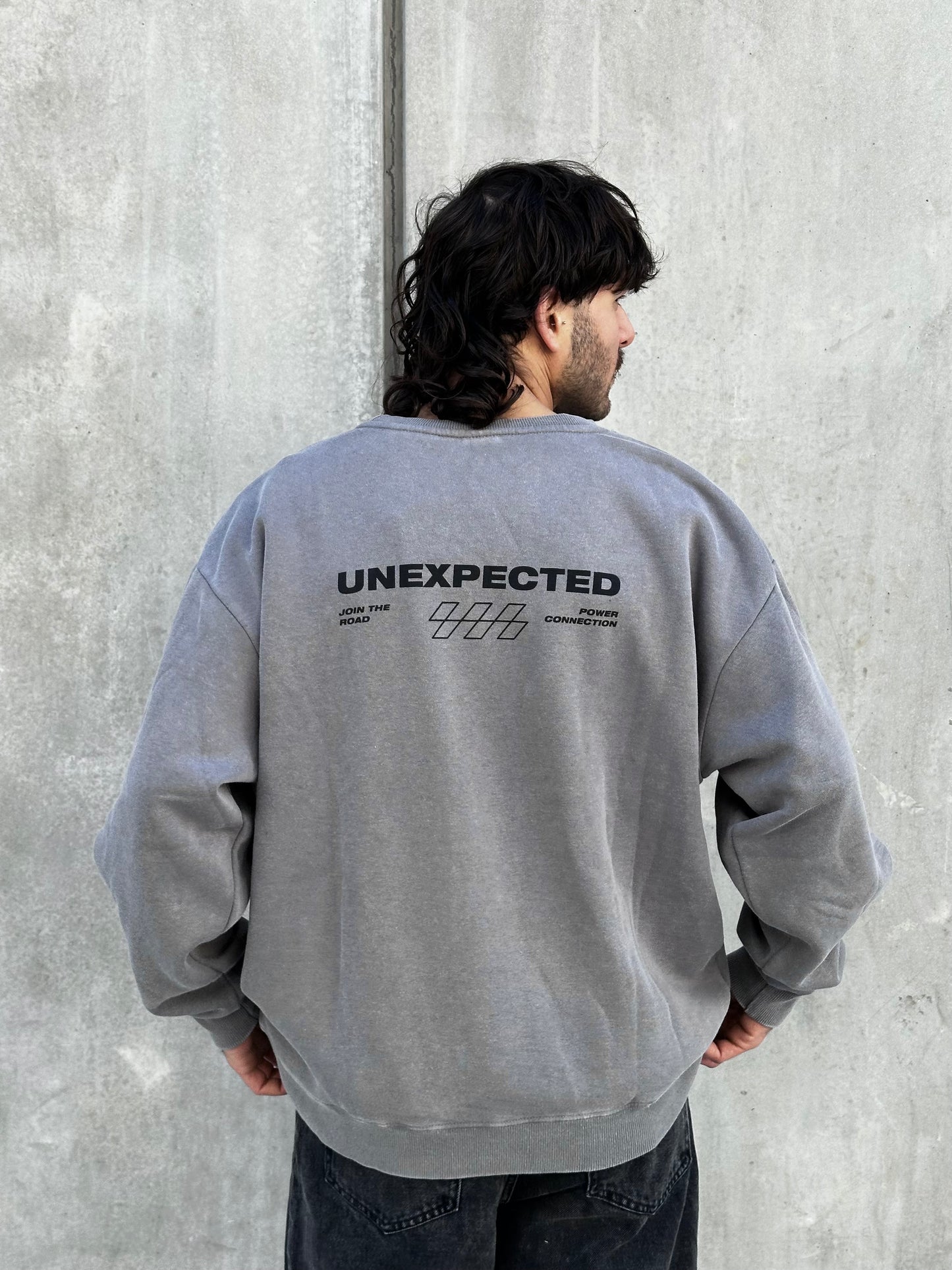 Buzo UNEXPECTED gris